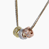 Eros Milano Necklaces Tri-Color Radiance 3-Ring Necklace with Brilliant CZ Accents in Gold, Rhodium and Rose Gold